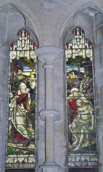 stained glass window picturing the Good Samaritan