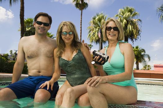 Two Women and a Man at the Pool