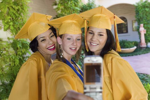 Graduates Using Cell Phone Camera
