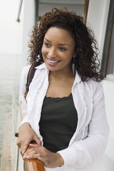 Woman Leaning on Boat Railing