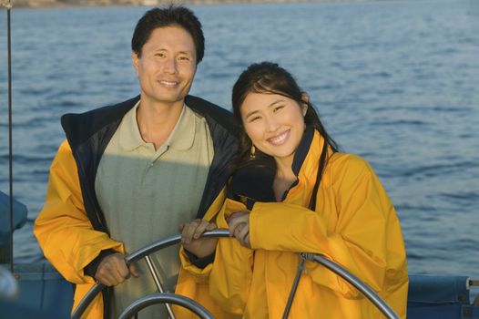 Couple at Helm of Boat