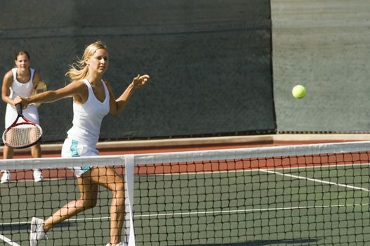 Doubles Player Hitting Backhand
