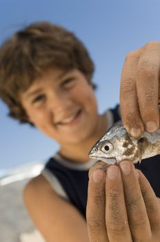 Boy Playing with Fish