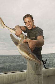 Sport Fisherman Displaying Shark