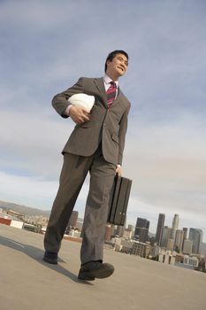 Businessman Carrying a Hard Hat
