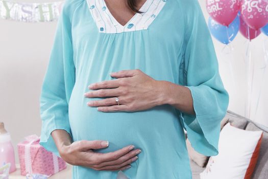 Pregnant Woman with Hands on Her Stomach