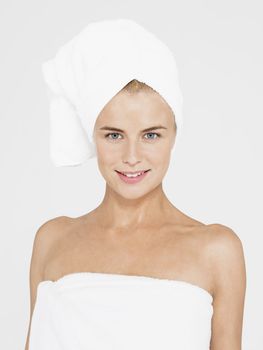 Young Woman Wrapped in Towels