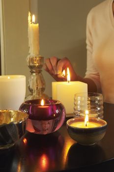 Woman Lighting Candles