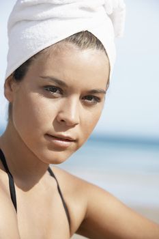 Young Woman with Hair Wrapped in Towel