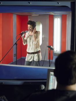 Young Woman Singing in Studio