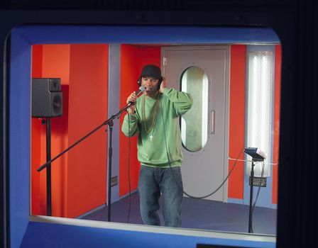 Young Man Singing in Studio