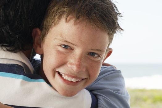 Close-up of Boy Hugging Father