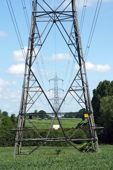 Electricity pylons with a blue sky background
