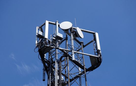 Telecommunication mast with a blue sky background 