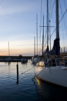 Yacht anchored on a marina in Malm�, Sweden at late afternoon light.