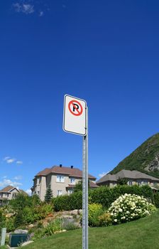 No parking sign in a rich suburban neighborhood