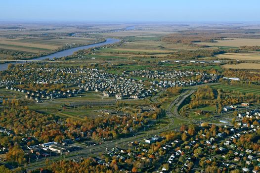 Aerial view of suburban neighborhood near highway