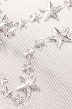 Holiday series: christmas silver stars on the corrugated paper