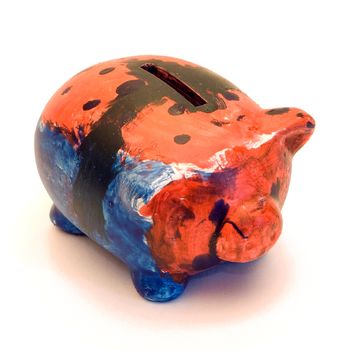 A small multi colored piggy bank, isolated on a white background