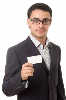 Young businessman holds an empty business card, isolated on white background.