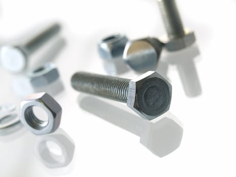 screws and nuts on a white background