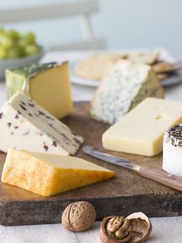 Selection of British Cheeses with Walnuts Biscuits and Grapes