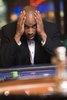 Man in casino playing roulette