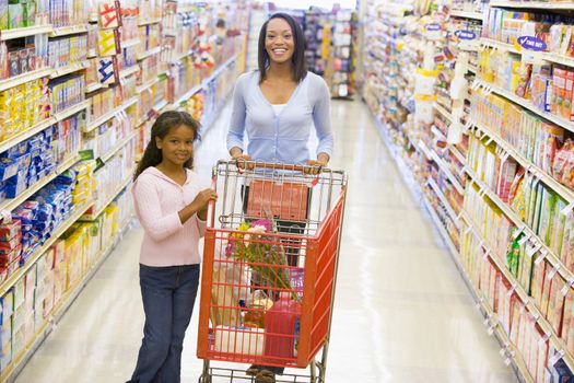 Mother and daughter grocery shopping