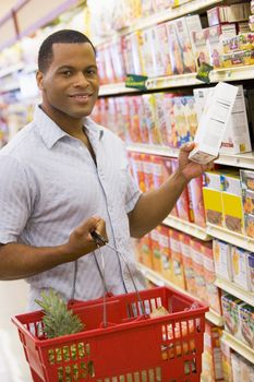 Young man grocery shopping