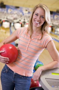 Woman at a bowling lane