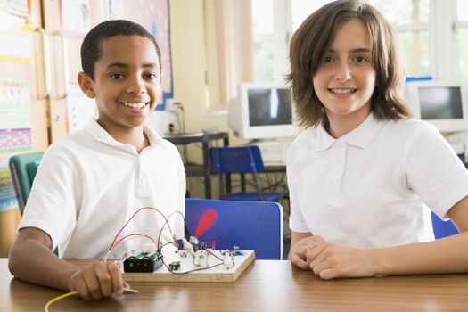 Students in class with electronic projects