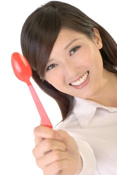 Business woman with tablespoon