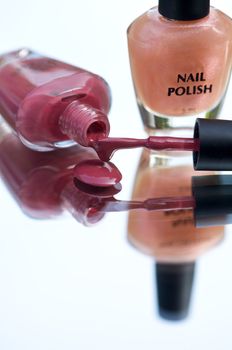 Container of nailpolish with brush on it's side