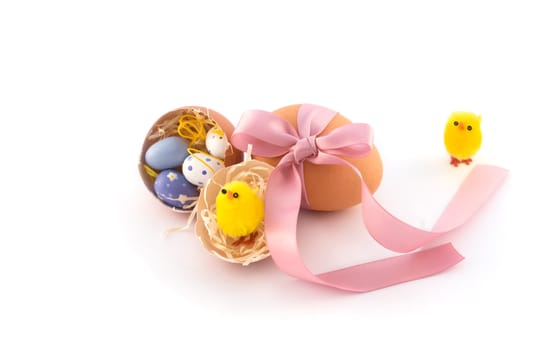 Natural easter eggs with pink bow and yellow chicken