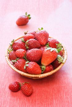 Wicker basket with fresh strawberries