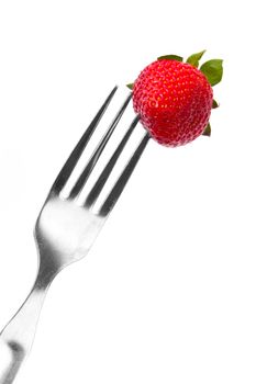 fork and fresh strawberry