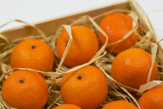 tangerines with straw