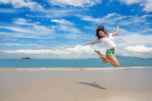 young girl jumping happily on a beutiful day