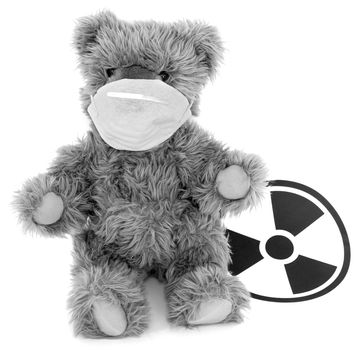 Toy baer and sign to radiation