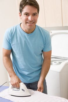 Man Ironing Shirt