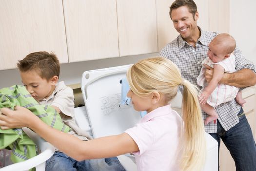 Father And Children Doing Laundry 