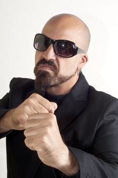 blacks man with glasses, beard and black jacket