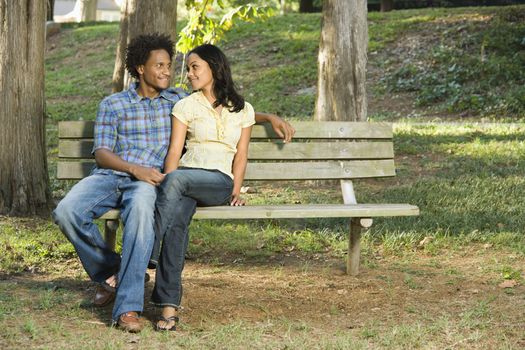 Couple on park bench.