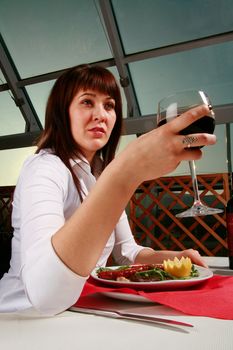 Girl holding a glass of wine