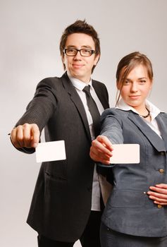 Business partners holding blank cards