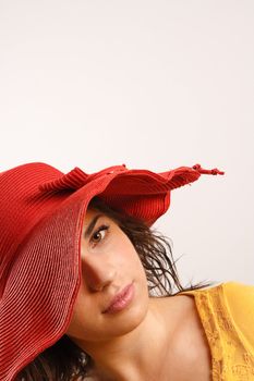 Portrait of attractive beautiful young woman wearing red hat