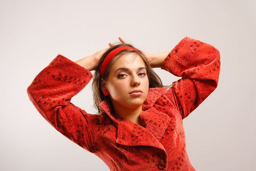 Portrait of attractive beautiful young woman wearing red jacket