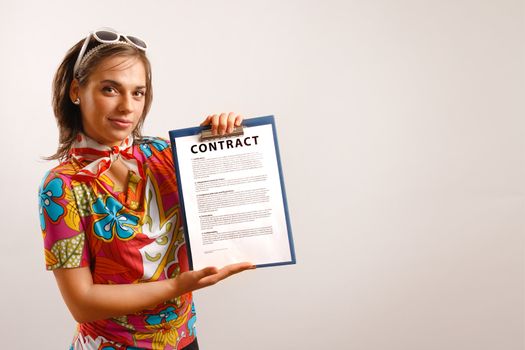 Attractive beautiful young woman holding a contract