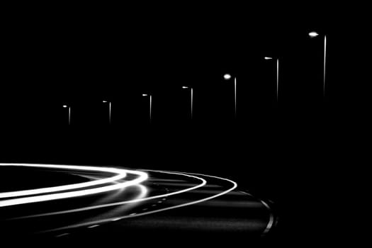 Light trails from cars and streetlights in the night. Black and White version