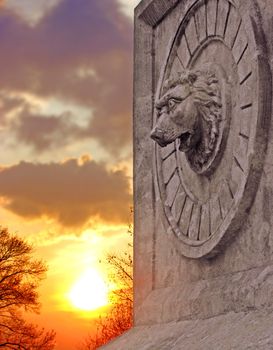 Stone lion at sunset
